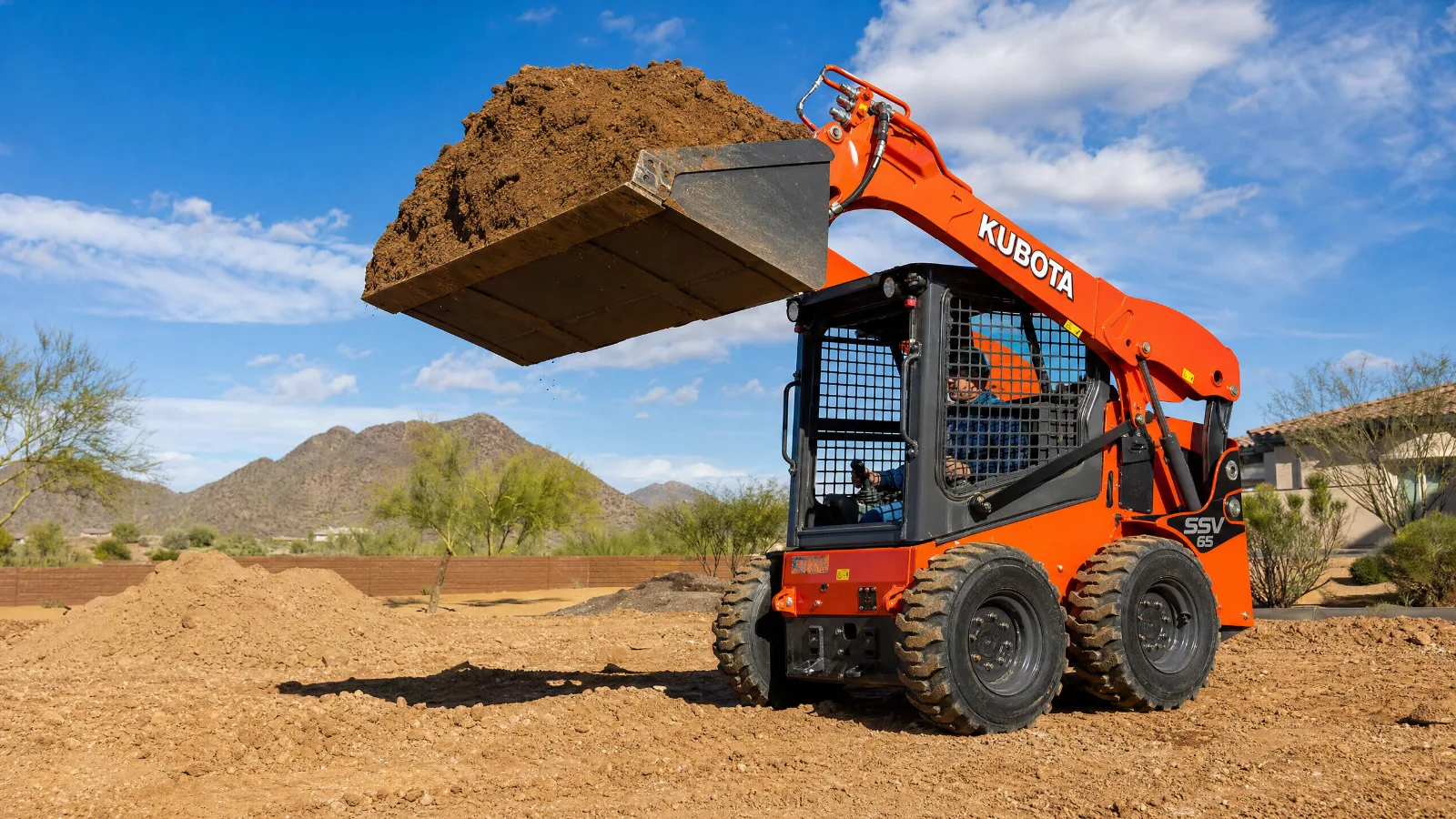 Kubota SSV65 heavy-duty skid steer rental from Rent A Loader with enclosed cab